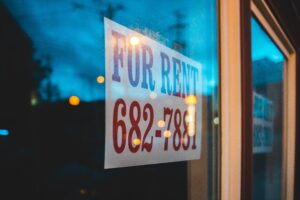 for rent sign hanging in landlords window